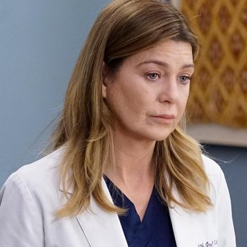dr meredith grey in medical coat looking concerned