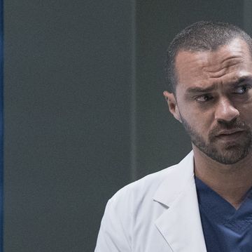 in a scene from grey's anatomy season 16, jesse williams as dr jackson avery stands in front of scan images of a brain