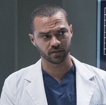 in a scene from grey's anatomy season 16, jesse williams as dr jackson avery stands in front of scan images of a brain
