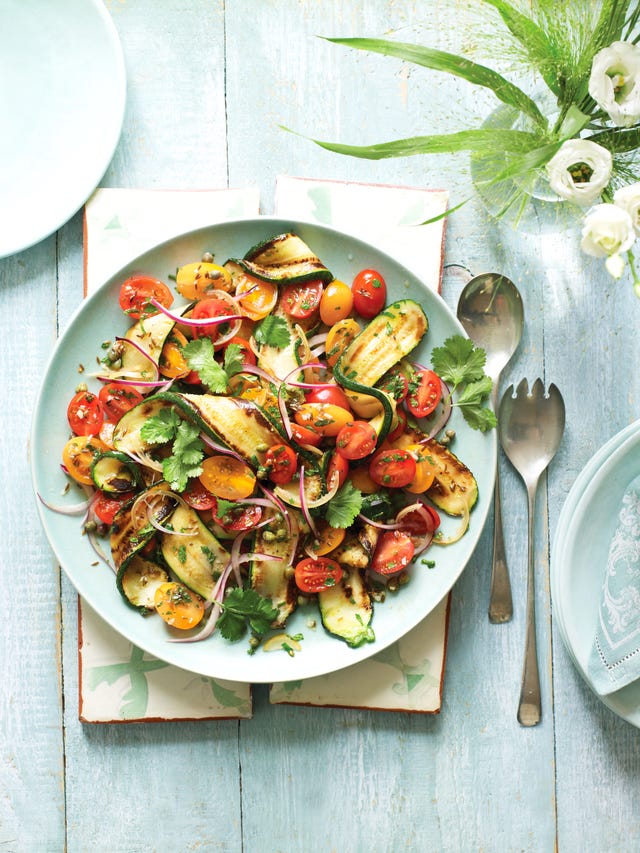 griddled courgette ribbons in a salad with tomatoes, red onion, lemon and herbs
