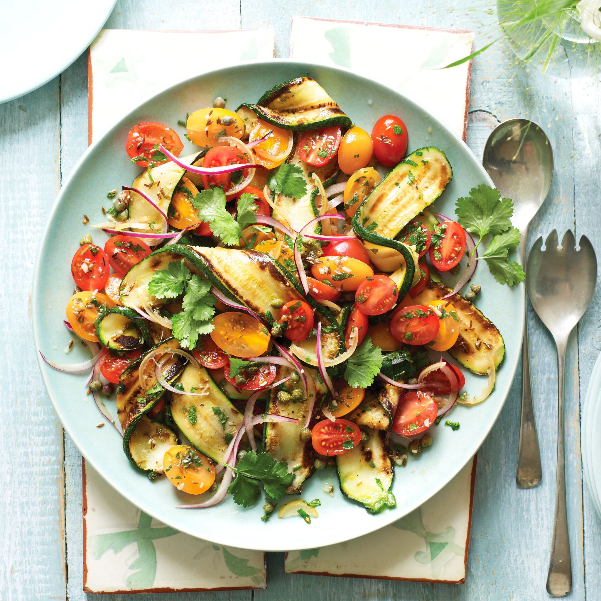griddled courgette ribbons in a salad with tomatoes, red onion, lemon and herbs