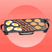 griddle with eggs, bacon, pancakes