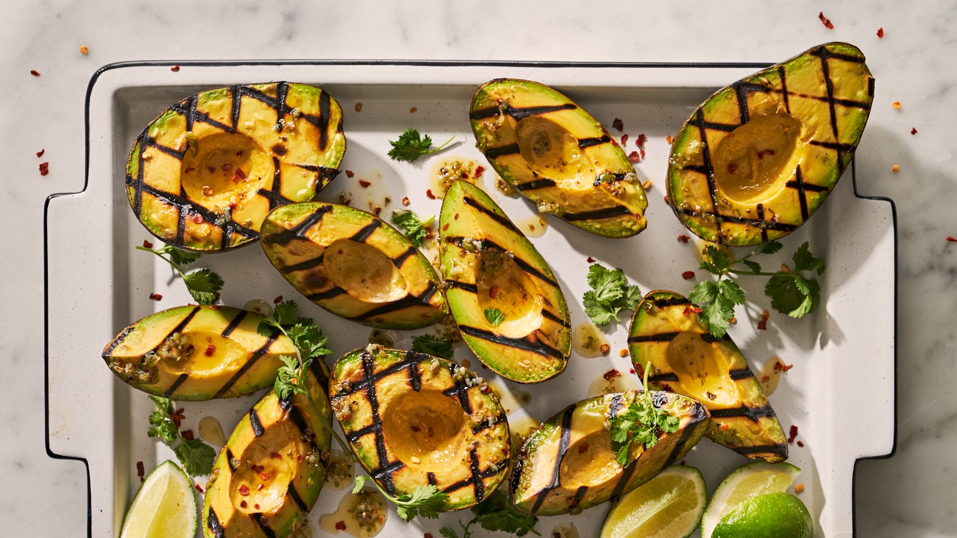 https://hips.hearstapps.com/hmg-prod/images/grilled-avocados1-1654092168.jpg?crop=1xw:0.8435280189423836xh;center,top
