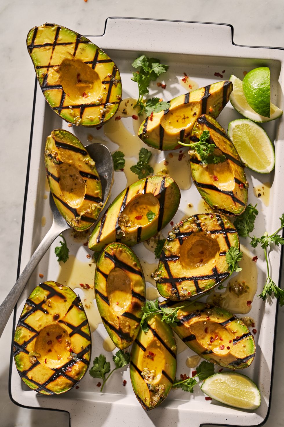 https://hips.hearstapps.com/hmg-prod/images/grilled-avocados2-1654092347.jpg?crop=0.888xw:0.889xh;0.0646xw,0.0454xh&resize=980:*