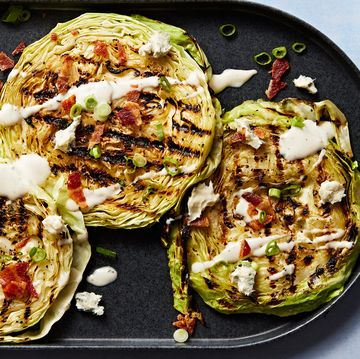 grilled cabbage steaks topped with bacon, sour cream and chives