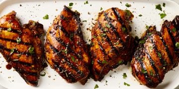 grilled chicken breasts topped with herbs