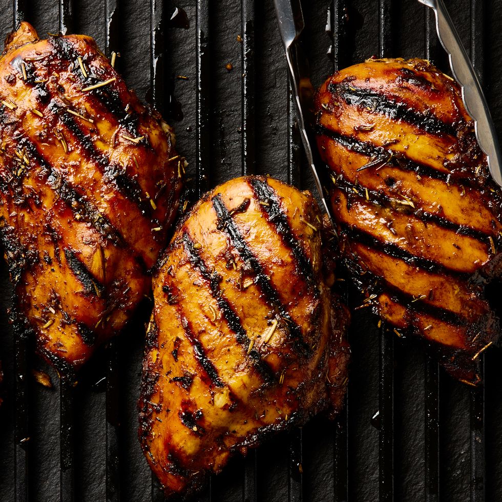 grilled chicken breasts topped with herbs
