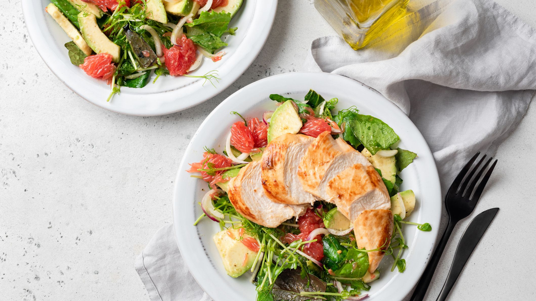 https://hips.hearstapps.com/hmg-prod/images/grilled-chicken-salad-with-avocado-royalty-free-image-1636121417.jpg?crop=1xw:0.84296xh;center,top
