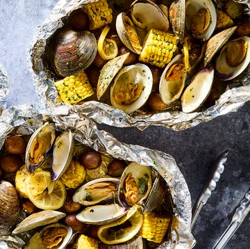 clams, corn, and potatoes in a grilled foil pack