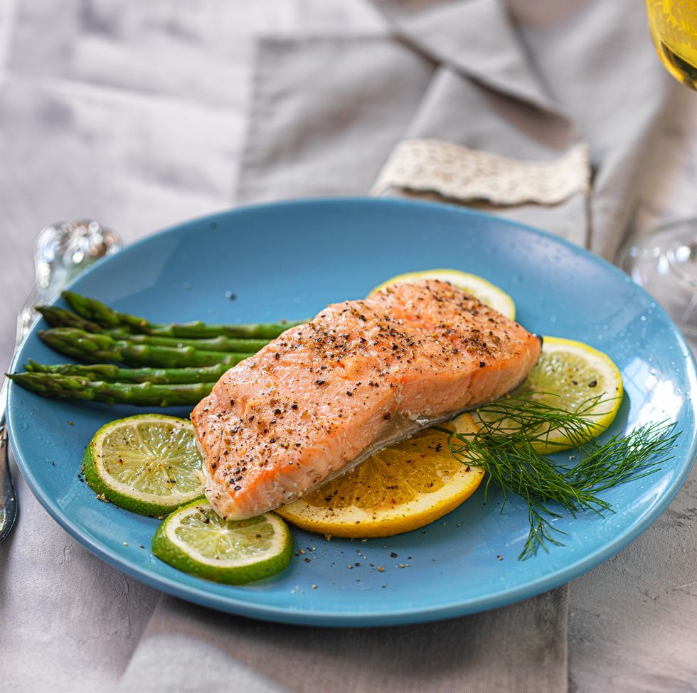 grilled fillet of salmon with asparagus served on a plate