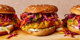 grilled fish sandwich with slaw and tzatziki on a multigrain bun