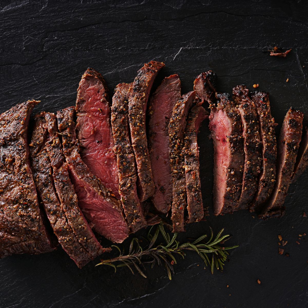 https://hips.hearstapps.com/hmg-prod/images/grilled-flat-iron-steak-shot-in-flat-lay-style-royalty-free-image-594463000-1550691204.jpg?crop=0.655xw:1.00xh;0.173xw,0&resize=1200:*
