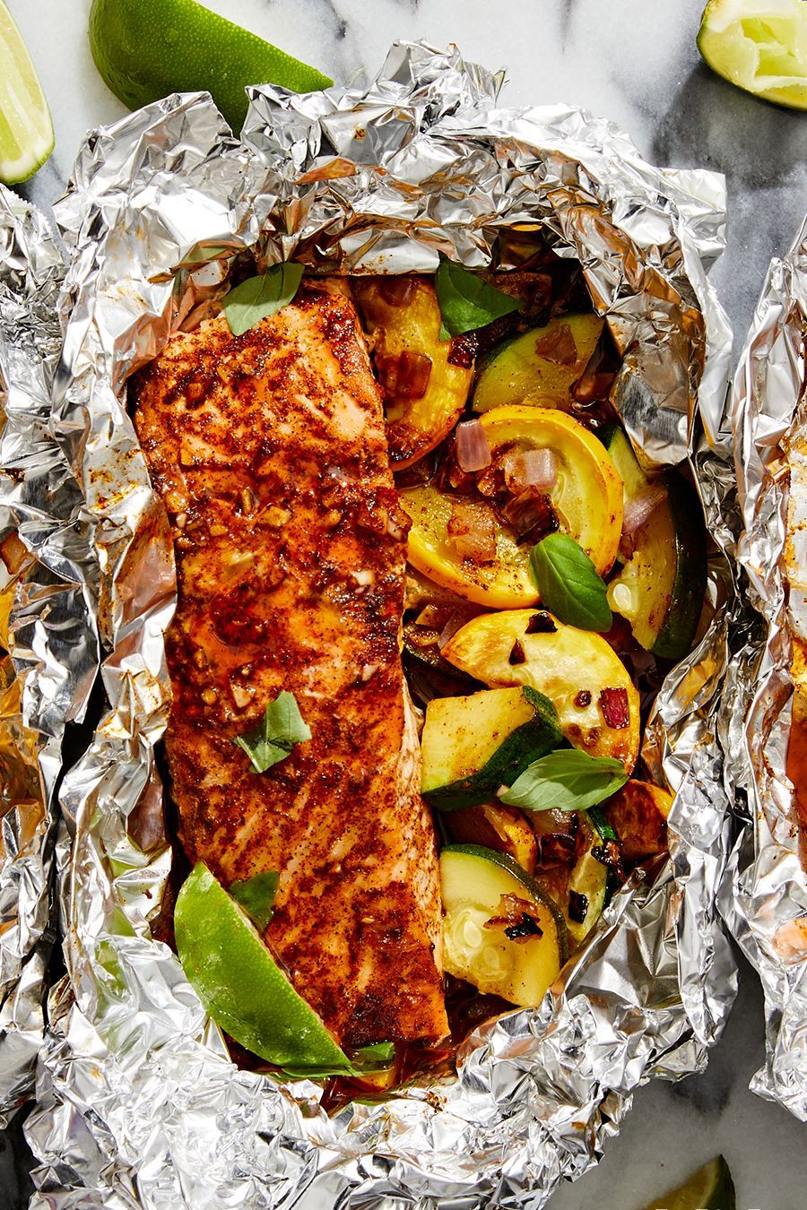 https://hips.hearstapps.com/hmg-prod/images/grilled-honey-chipotle-salmon-foil-packet-with-summer-squashpin-1660057555.jpg