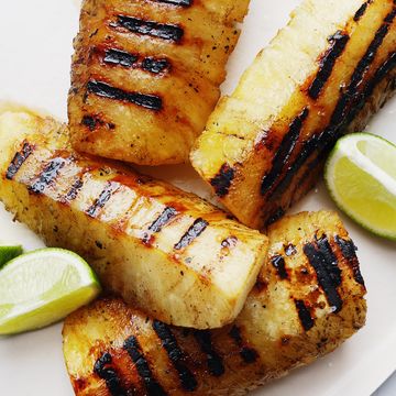 grilled pineapple with lime wedges