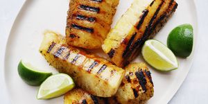 grilled pineapple with lime wedges