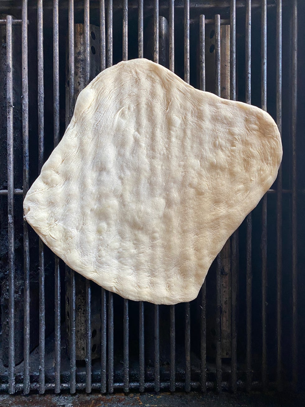 pizza dough on grill