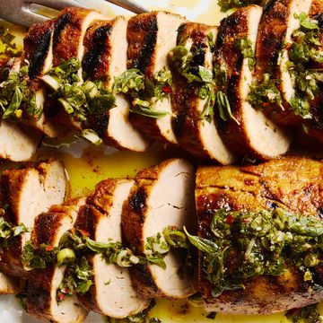 grilled pork tenderloin sliced and topped with a fresh herb sauce
