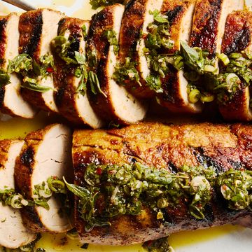 grilled pork tenderloin sliced and topped with a fresh herb sauce
