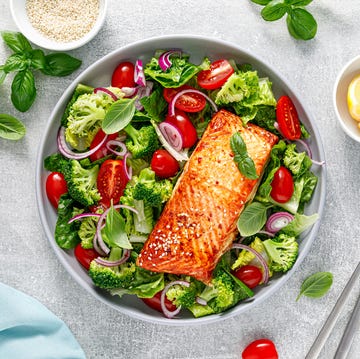 Grilled salmon fish fillet and fresh green leafy vegetable salad for Best Seafood Delivery story grilled salmon fish fillet and fresh green leafy vegetable salad for best seafood delivery story