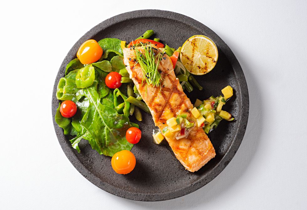grilled salmon steak with green salad