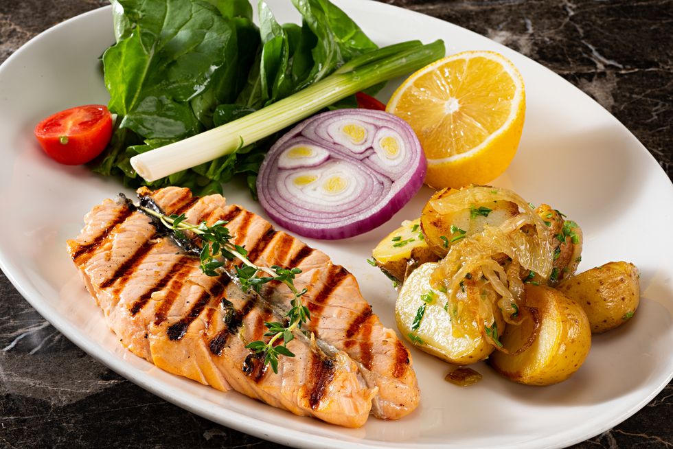 grilled salmon steak with prepared potatoes