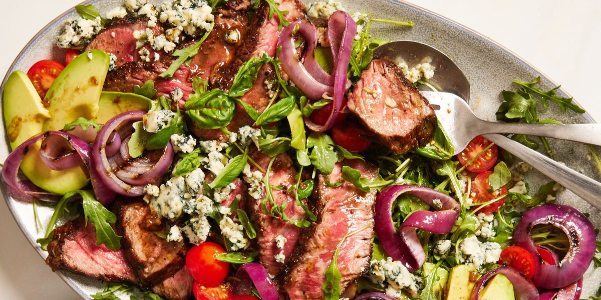 grilled steak salad with avocado, blue cheese, cherry tomatoes and red onions