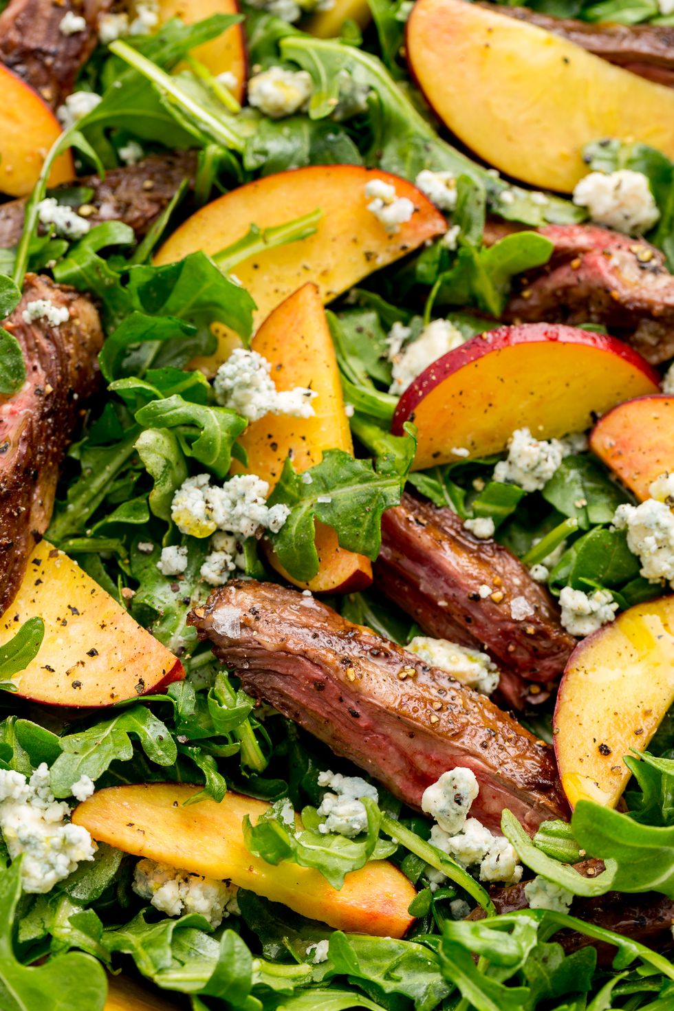 https://hips.hearstapps.com/hmg-prod/images/grilled-steak-salad-peaches-1648238831.jpg?crop=1xw:0.99975xh;center,top&resize=980:*
