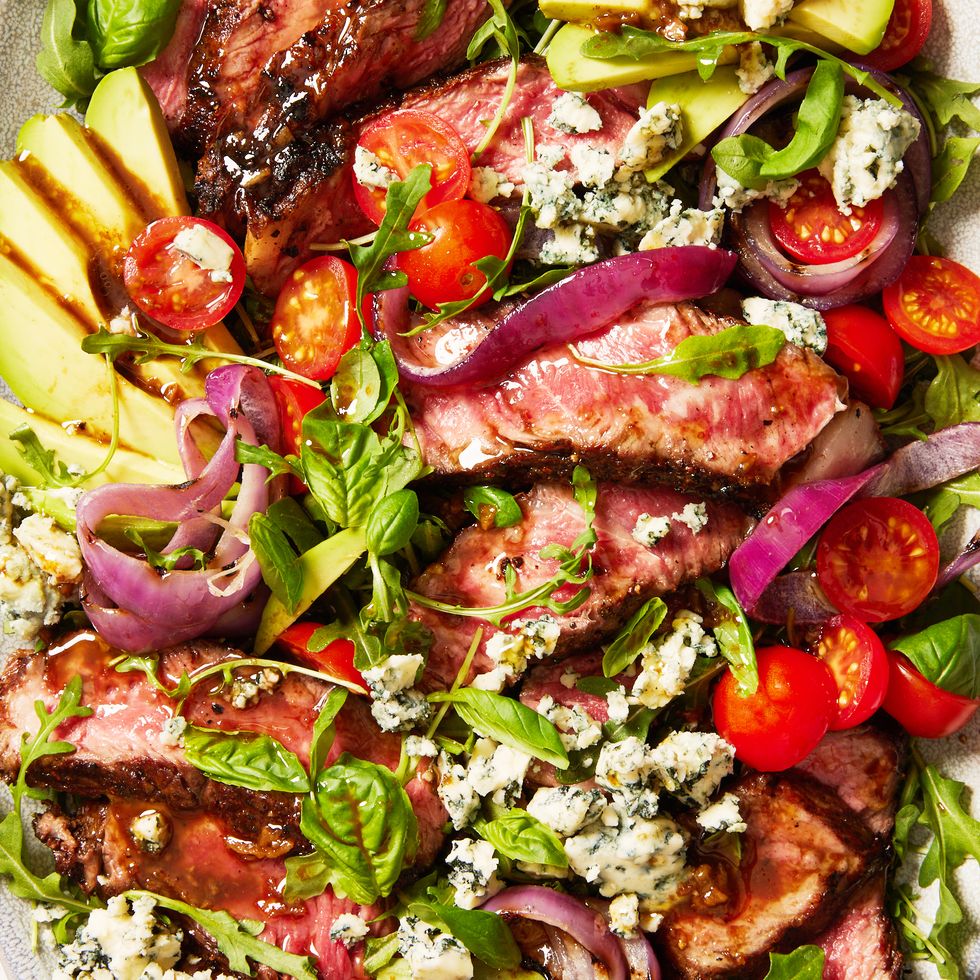 grilled steak salad with avocado, blue cheese, cherry tomatoes and red onions