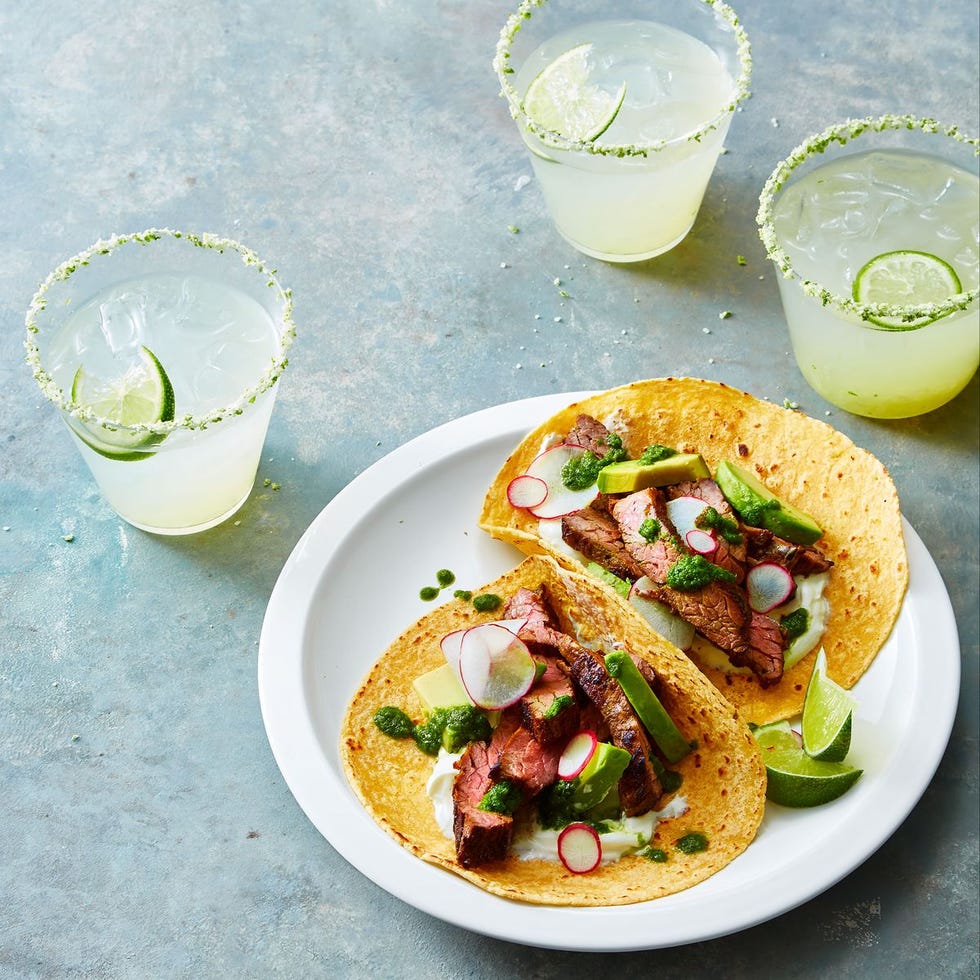 steak tacos with chimchurri sauce, sliced radishes and avocado