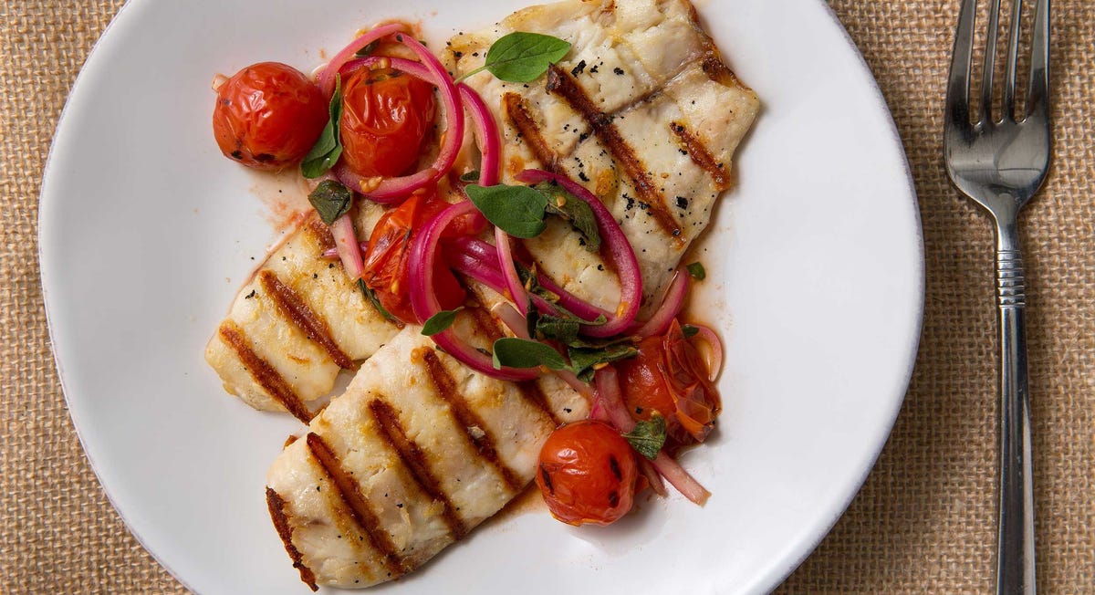 Video player poster image preview for This Grilled Tilapia With Burst Cherry Tomatoes Is A Summer Date Night Classic