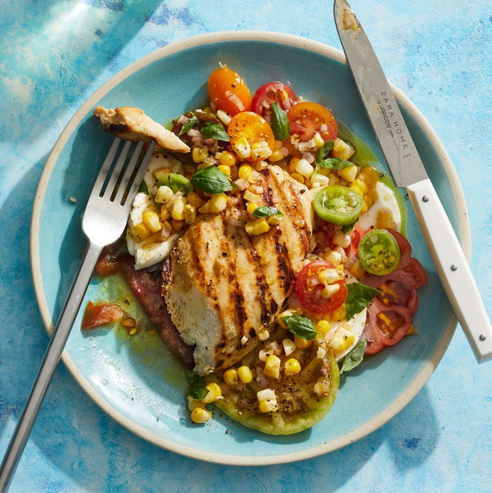 grilled chicken caprese over a corn and tomato salad