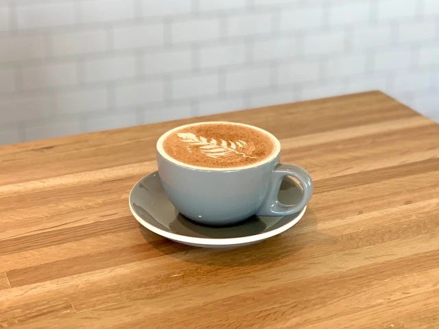 a cup of coffee on a saucer