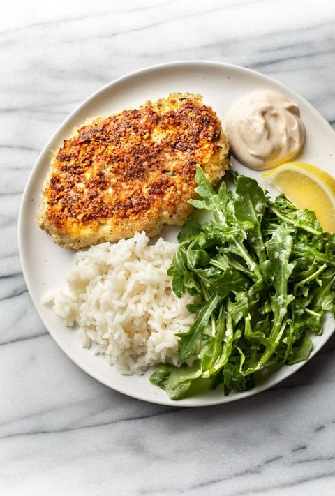 chicken patties on plate with rice and arugula