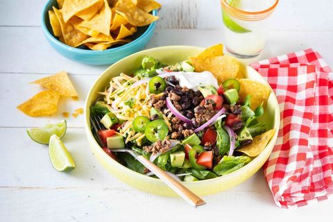 easy taco salad with jalapenos and chips in bowl