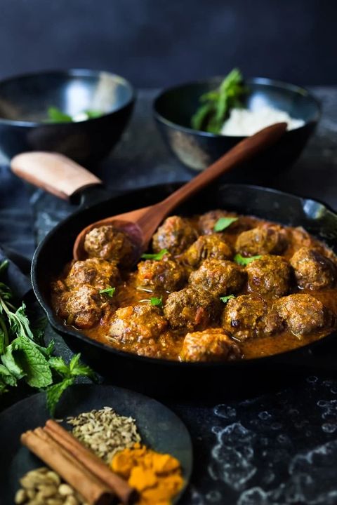 lamb meatballs with indian curry  in skillet