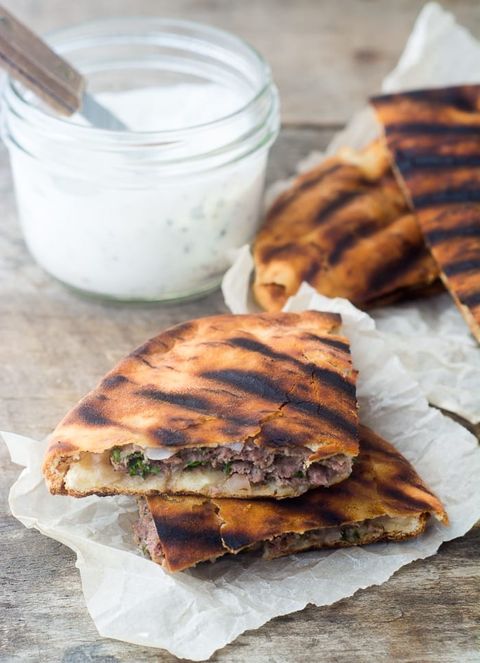 spiced lamb burgers in flat grilled pitas with dip
