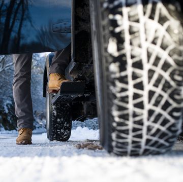 Ground view of a jeep tyre on a snow-covered road