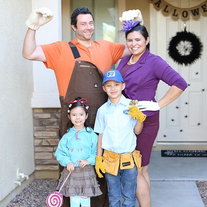 group halloween costumes, a man, woman and their two kids dressed as characters from wreck it ralph animation