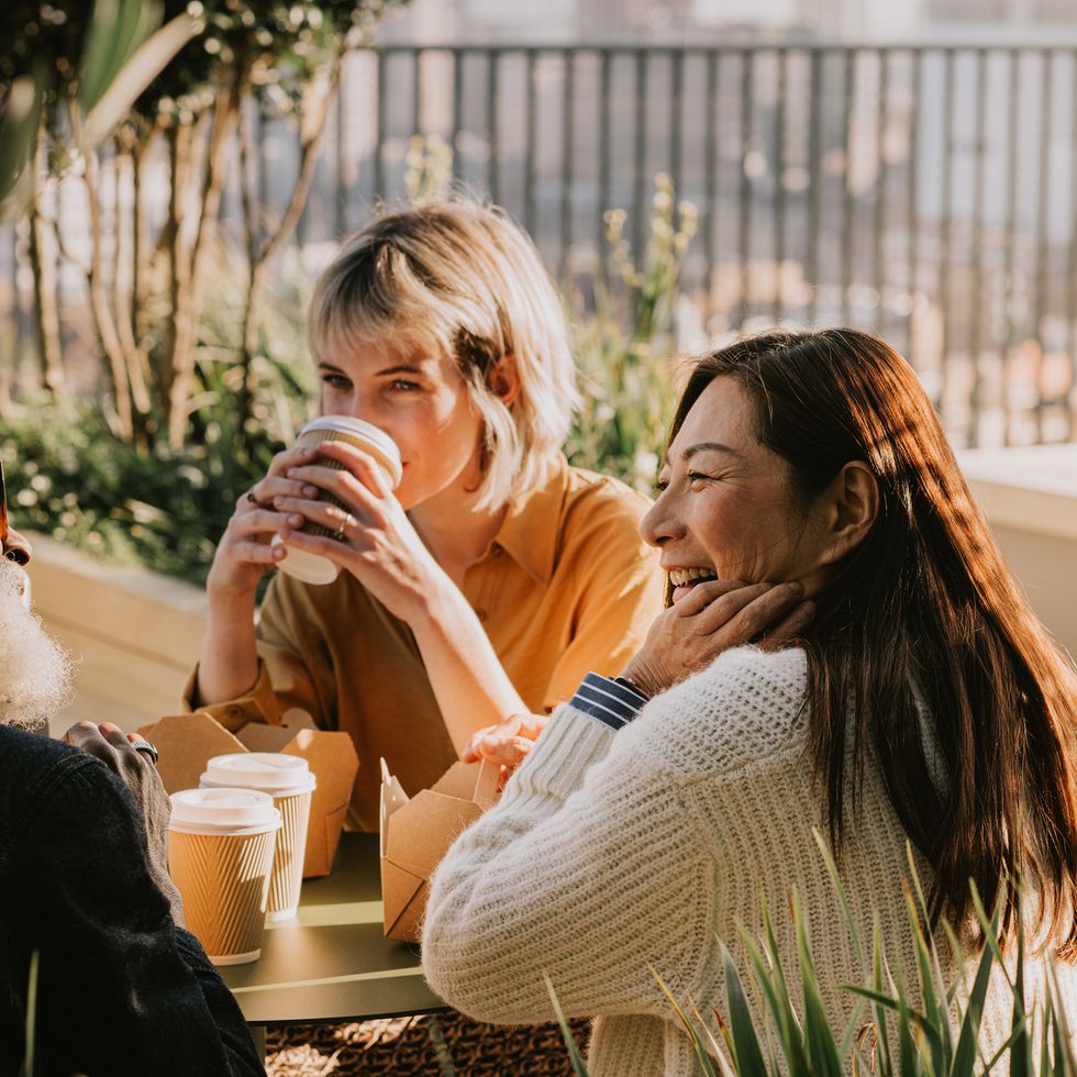 a group of coworkers enjoy an alfresco lunch