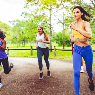 group of female athletes sprinting in a friendly race
