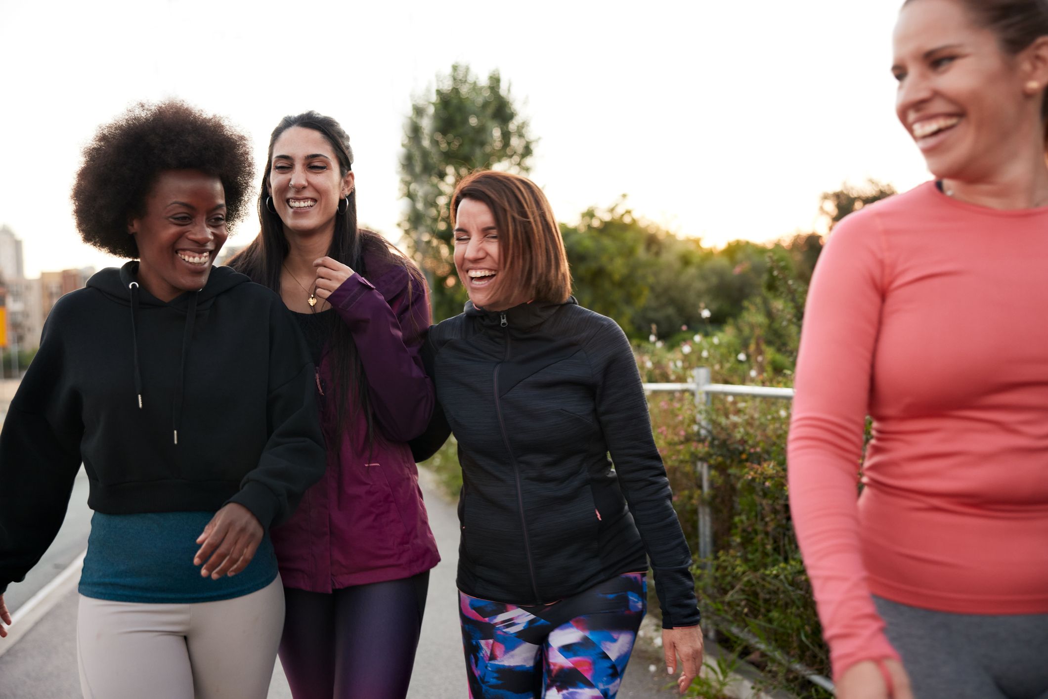 group of female friends walking and talking after royalty free image