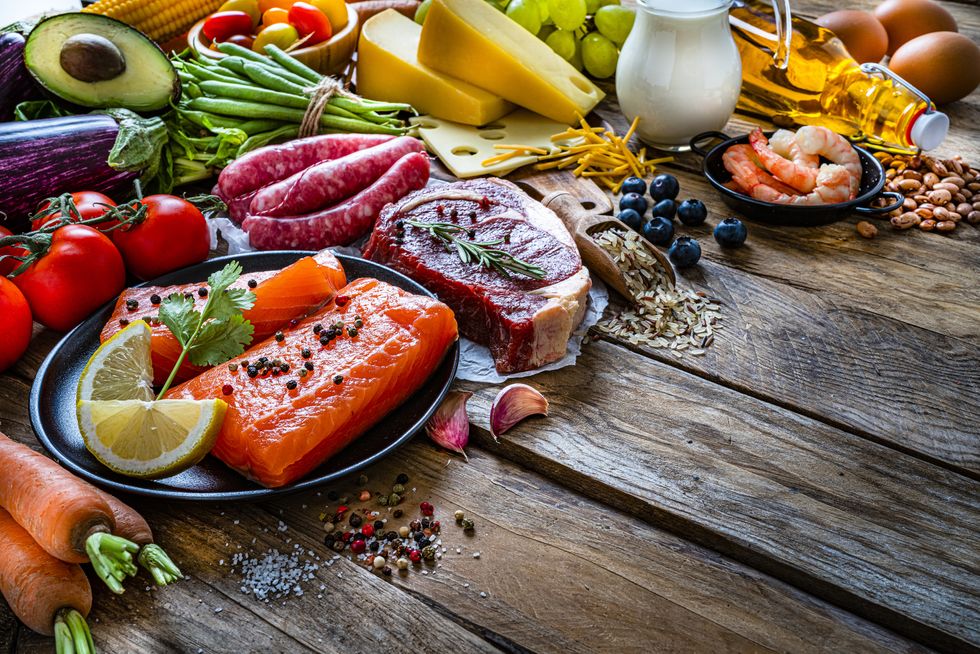 group of food containing carbohidrates, protein and dietary fiber shot on wooden table