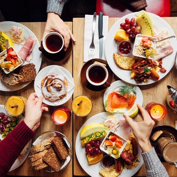 group of friends having celebration dinner together, directly above view