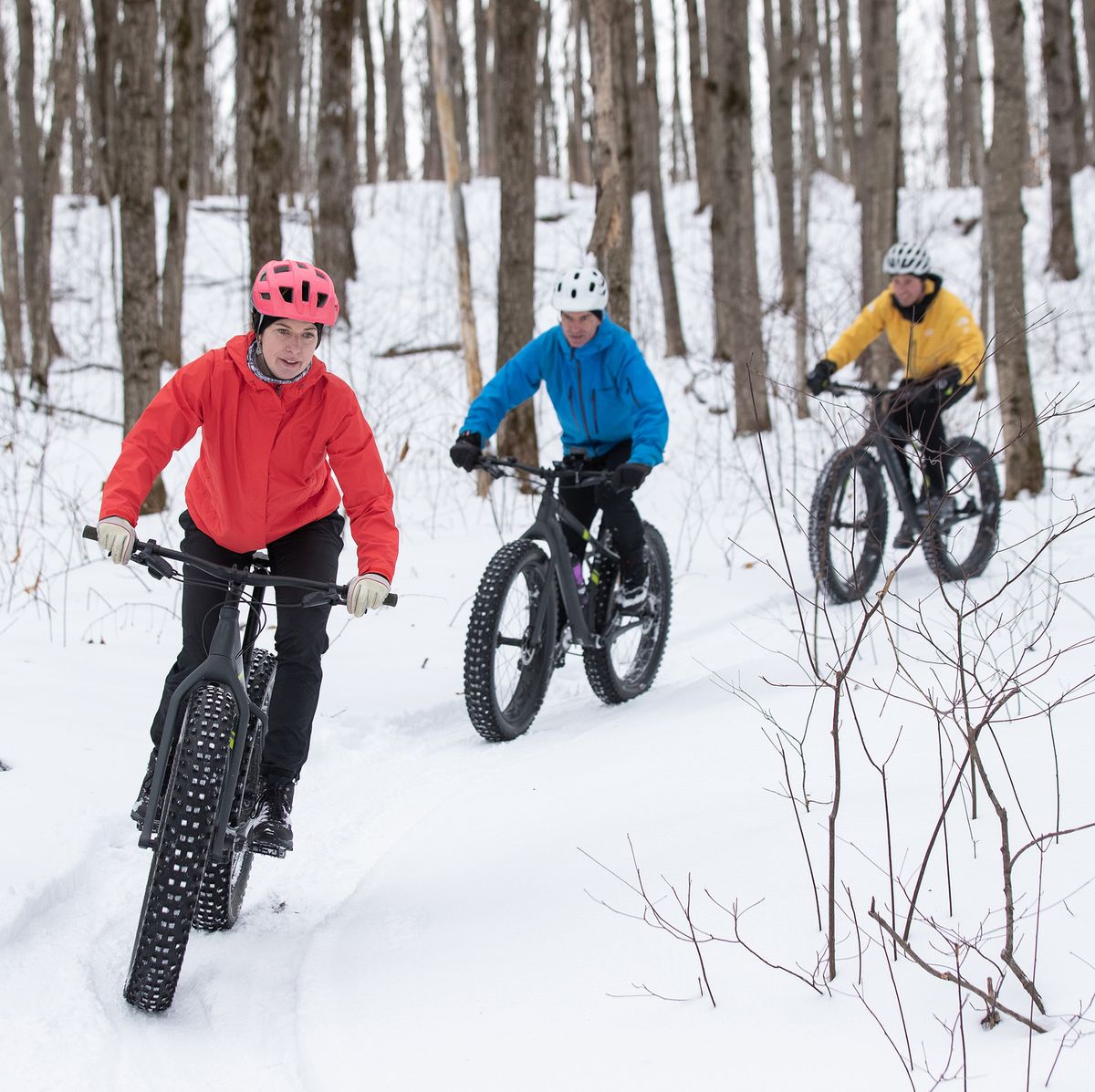 group of friends riding their fat bike in the snow in ontario, canada