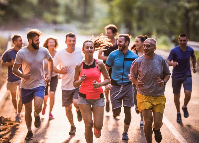 group of marathon runners having a race through nature.