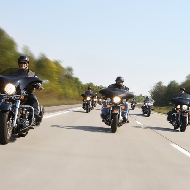 Group of motorcyclists riding, (blurred motion)