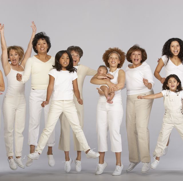 group of multi generational family, jumping, portrait