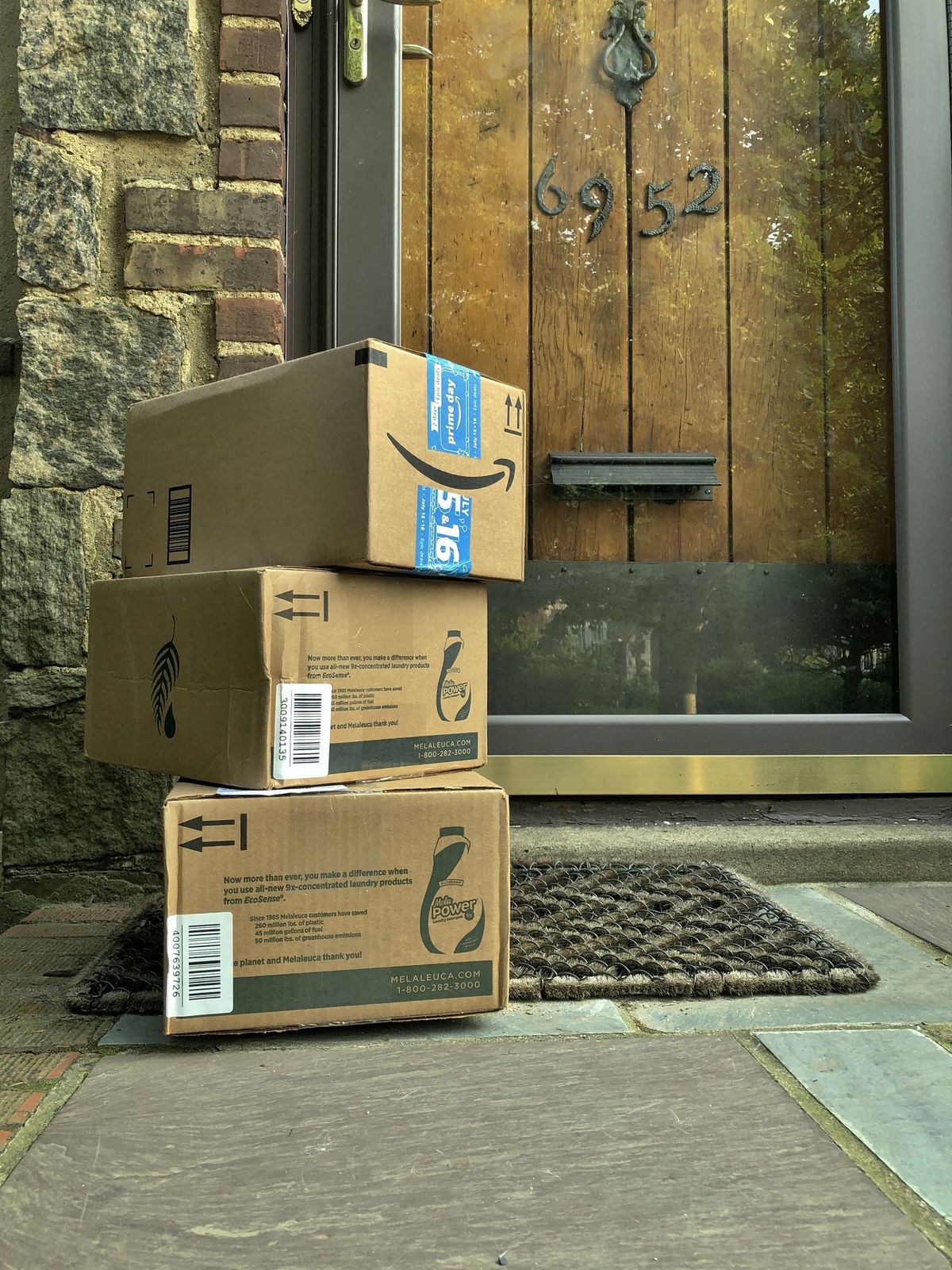 group of packages delivery to doorsteps on staircase of house