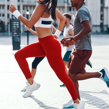 group of people in sports clothing jogging