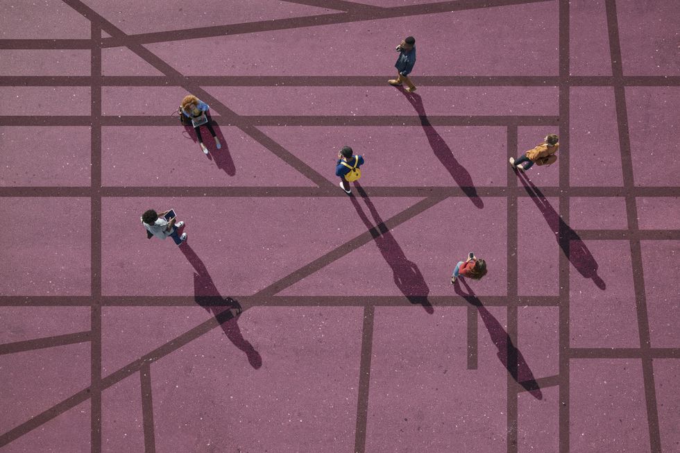 Group of people standing & sitting on roads, painted on asphalt